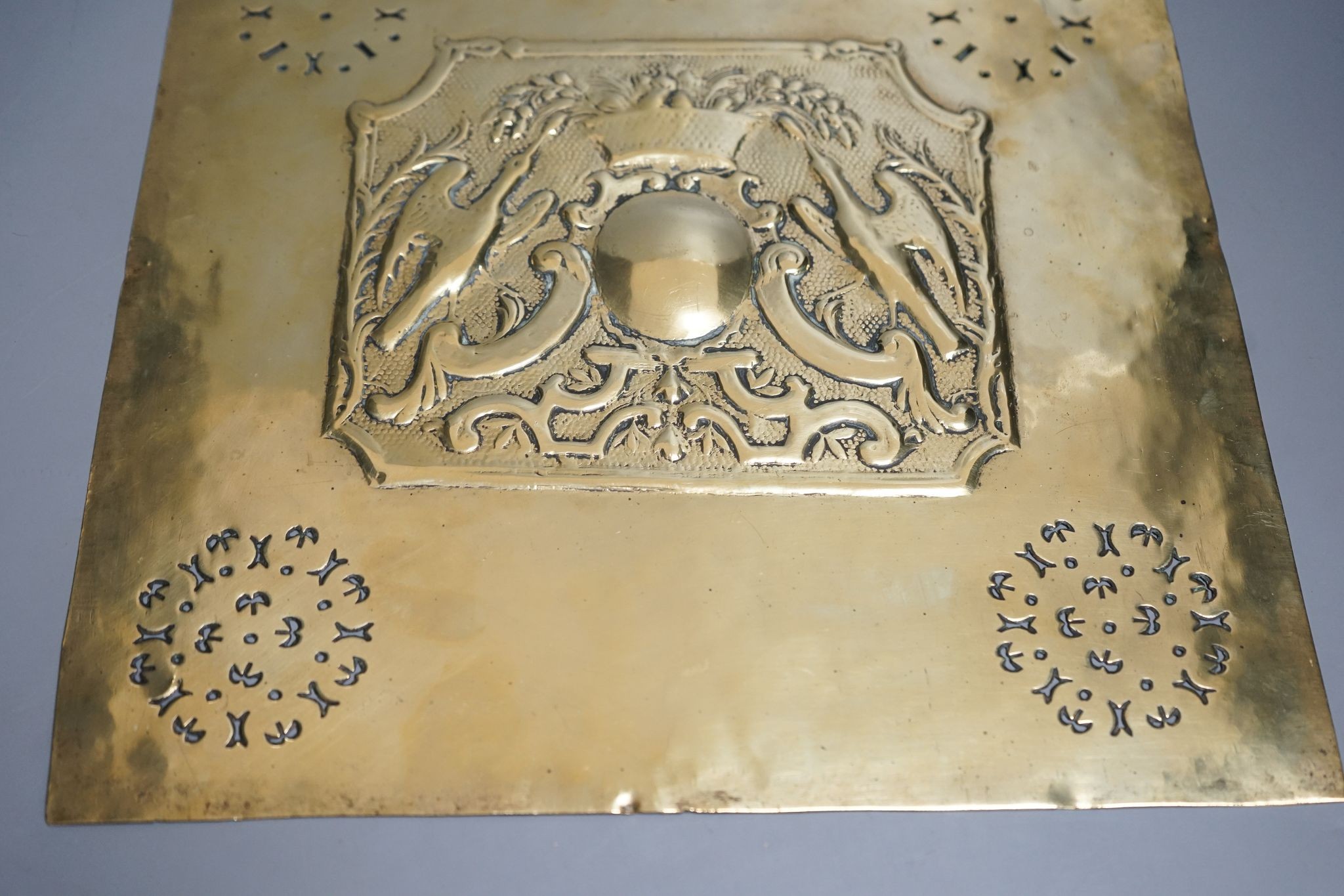 A Georgian pierced and embossed brass plate/panel, 37x32cm